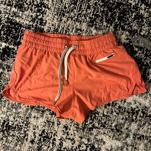 Vuori Coral Orange Athletic Shorts